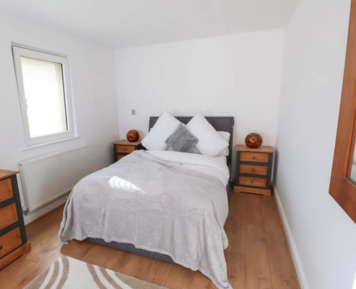 Comfortable double bedroom at Sea Breeze Retreat holiday home in Pwllheli